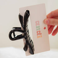 Shop ANDi Claw Clip - Bow loop Black